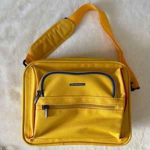 United Colors of Benetton yellow small travel bag. Bag is 10x12.